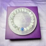 Selenite with evil eye crystal bracelet + Selenite plate